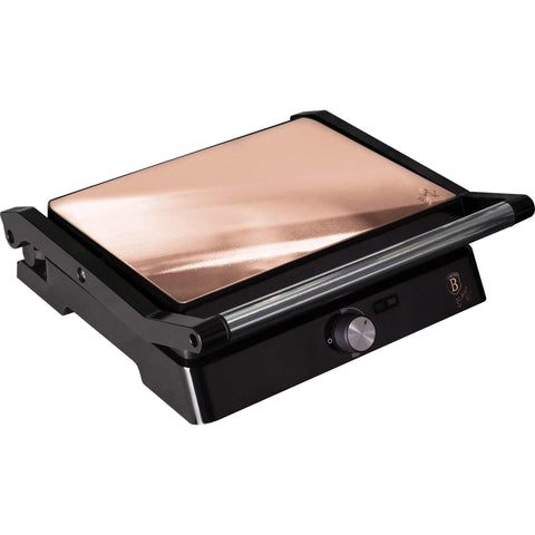 Product image of Electric grill with oil drip pan. Part of the Metallic Line Rose Gold Edition . Features: • Power: 2200W • Voltage: 220-240 V • NON-STICK coating on plate • Plate size: 29*23 cm • Color: rose gold • 2 IN 1 2 TYPES OF OPENING • Opening in.... (Studio view). Official Berlinger Haus product, boosted by Promintra sl.