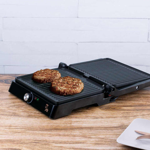 Product image of Electric grill with oil drip pan. Part of the Metallic Line Rose Gold Edition . Features: • Power: 2200W • Voltage: 220-240 V • NON-STICK coating on plate • Plate size: 29*23 cm • Color: rose gold • 2 IN 1 2 TYPES OF OPENING • Opening in.... (Studio view). Official Berlinger Haus product, boosted by Promintra sl.