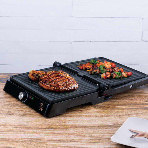 Product image of Electric grill with oil drip pan. Part of the Metallic Line Rose Gold Edition . Features: • Power: 2200W • Voltage: 220-240 V • NON-STICK coating on plate • Plate size: 29*23 cm • Color: rose gold • 2 IN 1 2 TYPES OF OPENING • Opening in.... (Studio view). Official Berlinger Haus product, boosted by Promintra sl.