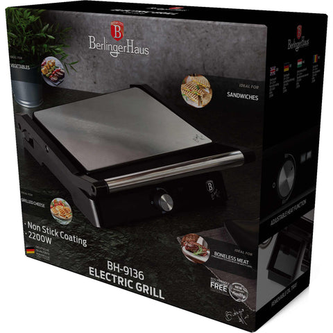Product image of Electric grill with oil drip pan. Part of the Black Vantage Collection/Matte Black Collection/Black Silver Collection/Eternal Collection . Features: • Power: 2200W • Voltage: 220-240 V • NON-STICK coating on plate • Plate size: 29*23 cm • Color: stainless steel • 2 IN 1 2 TYPES OF OPENING. (Studio view). Official Berlinger Haus product, boosted by Promintra sl.