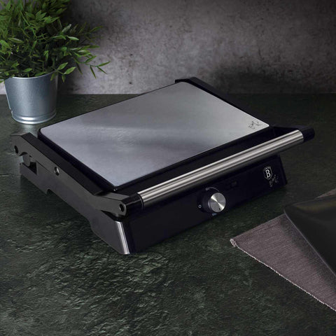 Product image of Electric grill with oil drip pan. Part of the Black Vantage Collection/Matte Black Collection/Black Silver Collection/Eternal Collection . Features: • Power: 2200W • Voltage: 220-240 V • NON-STICK coating on plate • Plate size: 29*23 cm • Color: stainless steel • 2 IN 1 2 TYPES OF OPENING. (Studio view). Official Berlinger Haus product, boosted by Promintra sl.