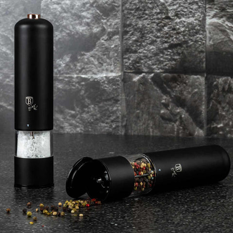 Product image of Electric pepper and salt mill 2pcs set. Part of the Black Rose Collection . Features: • Material: stainless steel with CERAMIC grinder • Batteries: 4 pcs AA (not inc.) • WITH LIGHT • Color: black- rose gold • 2 pcs set. (Lifestyle view). Official Berlinger Haus product, boosted by Promintra sl.