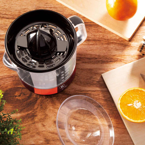Product image of Electric citrus juicer. Part of the Metallic Line Burgundy Edition . Features: • Material: plastic, stainless steel • 220-240V/100-127VAC 50/60Hz 40W • Capacity: 0,7 L • Color: metallic burgundy. (Studio view). Official Berlinger Haus product, boosted by Promintra sl.