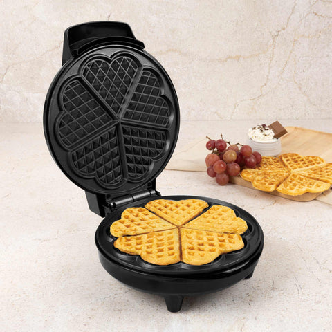 Product image of Waffle maker flower shape. Part of the Metallic Line Rose Gold Edition . Features: • Power: 700W • Voltage: 220-240 V, 50/60Hz • Plate size: 20,32 cm • NON-STICK TITAN black coating on plate • Color: rose gold. (Studio view). Official Berlinger Haus product, boosted by Promintra sl.