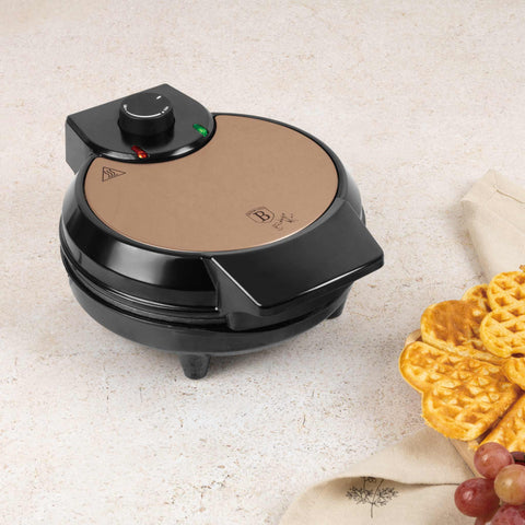Product image of Waffle maker flower shape. Part of the Metallic Line Rose Gold Edition . Features: • Power: 700W • Voltage: 220-240 V, 50/60Hz • Plate size: 20,32 cm • NON-STICK TITAN black coating on plate • Color: rose gold. (Studio view). Official Berlinger Haus product, boosted by Promintra sl.