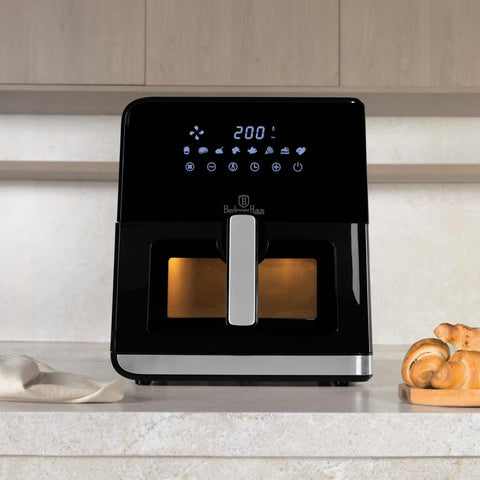 Product image of Air fryer 7,5L visible window. Part of the Black Vantage Collection/Matte Black Collection/Black Silver Collection/Eternal Collection . Features: • Power: 100-127V/220-240V ~ 1700W • Temperature control: 80-200℃ • Include: • XXXL SIZE: Food basket with non-stick coating 7,5L • DIGITAL • Color.... (Studio view). Official Berlinger Haus product, boosted by Promintra sl.