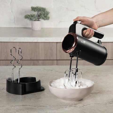 Product image of Hand mixer with stand. Part of the Black Rose Collection . Features: • Material: plastic and stainless steel • Include: • 2 pcs beaters for eggs and cream • 2 pcs hooks for mixing dough • Voltage: 220-240 V, 50/60 Hz.... (Studio view). Official Berlinger Haus product, boosted by Promintra sl.