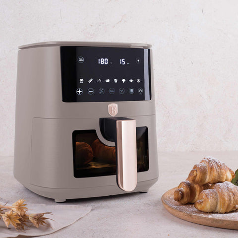 Product image of Air fryer 5L visible window. Part of the Taupe Collection . Features: • Power: 220-240V ~ 1400W • Temperature control: 40-200℃ • Include: • XL SIZE: food basket with non-stick coating 5L • DIGITAL • Color: matt taupe. (Studio view). Official Berlinger Haus product, boosted by Promintra sl.