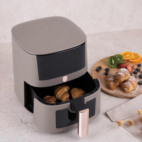 Product image of Air fryer 5L visible window. Part of the Taupe Collection . Features: • Power: 220-240V ~ 1400W • Temperature control: 40-200℃ • Include: • XL SIZE: food basket with non-stick coating 5L • DIGITAL • Color: matt taupe. (Studio view). Official Berlinger Haus product, boosted by Promintra sl.