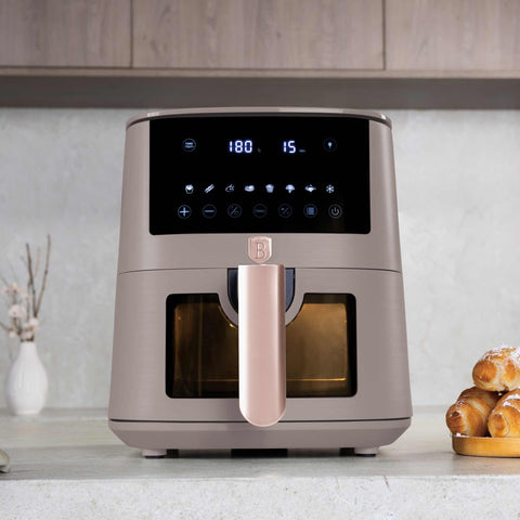Product image of Air fryer 5L visible window. Part of the Taupe Collection . Features: • Power: 220-240V ~ 1400W • Temperature control: 40-200℃ • Include: • XL SIZE: food basket with non-stick coating 5L • DIGITAL • Color: matt taupe. (Studio view). Official Berlinger Haus product, boosted by Promintra sl.