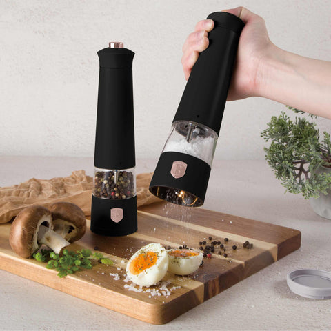Product image of Electric pepper and salt mill 2pcs set. Part of the Black Rose Collection . Features: • Material: plastic with CERAMIC grinder • Batteries: 4 pcs AAA (not inc.) • WITH LIGHT • Color: black- rose gold • 2 pcs set. (Studio view). Official Berlinger Haus product, boosted by Promintra sl.