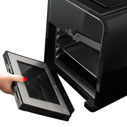 Imagem do forno Air Fryer de 12L. Parte da Coleção Black Rose. Características: • Potência: 220-240V ~ 50Hz/60Hz 2000W • Controle de temperatura: 30-200℃ • Capacidade: 12L • Inclui: • 3 grelhas de malha • Acessório para retirar alimentos • Espeto giratório .... (Vista de estúdio). Produto oficial Berlinger Haus, com o apoio da Promintra sl.