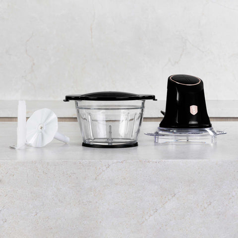 Product image of Multi chopper with glass bowl. Part of the Black Rose Collection . Features: • Material: stainless steel, glass, plastic • Power: 500 W • 220-240 V 50 Hz • Bowl capacity: 1,3L • Working capacity: 1L • Color: black- rose gold. (Studio view). Official Berlinger Haus product, boosted by Promintra sl.