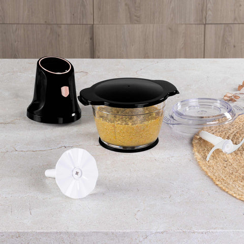Product image of Multi chopper with glass bowl. Part of the Black Rose Collection . Features: • Material: stainless steel, glass, plastic • Power: 500 W • 220-240 V 50 Hz • Bowl capacity: 1,3L • Working capacity: 1L • Color: black- rose gold. (Studio view). Official Berlinger Haus product, boosted by Promintra sl.