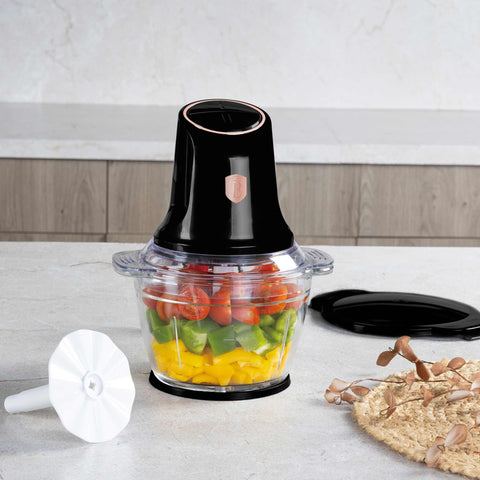 Product image of Multi chopper with glass bowl. Part of the Black Rose Collection . Features: • Material: stainless steel, glass, plastic • Power: 500 W • 220-240 V 50 Hz • Bowl capacity: 1,3L • Working capacity: 1L • Color: black- rose gold. (Studio view). Official Berlinger Haus product, boosted by Promintra sl.