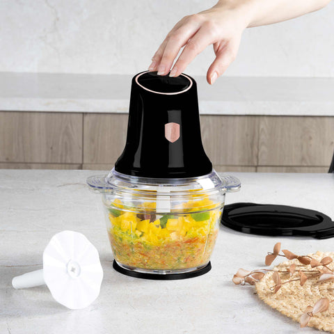 Product image of Multi chopper with glass bowl. Part of the Black Rose Collection . Features: • Material: stainless steel, glass, plastic • Power: 500 W • 220-240 V 50 Hz • Bowl capacity: 1,3L • Working capacity: 1L • Color: black- rose gold. (Studio view). Official Berlinger Haus product, boosted by Promintra sl.