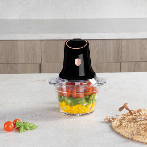Product image of Multi chopper with glass bowl. Part of the Black Rose Collection . Features: • Material: stainless steel, glass, plastic • Power: 500 W • 220-240 V 50 Hz • Bowl capacity: 1,3L • Working capacity: 1L • Color: black- rose gold. (Studio view). Official Berlinger Haus product, boosted by Promintra sl.
