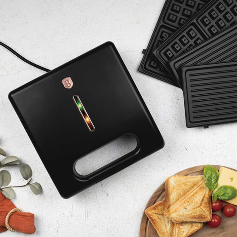 Product image of 3in1 sandwich maker with detachable plates. Part of the Black Rose Collection . Features: • Material: aluminium, bakelite • Power: 780 W • Voltage: 220-240 V, 50/60Hz • Plate size: 22,5*13 cm • NON-STICK coating • Color: black- rose gold. (Studio view). Official Berlinger Haus product, boosted by Promintra sl.