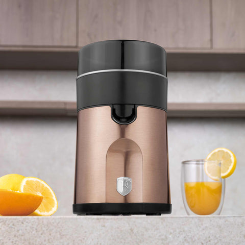Product image of Juice extractor. Part of the Metallic Line Rose Gold Edition . Features: • Citrus juicer • Material: stainless steel • 85W • Juice cup 300 ml • 2 pcs squeezer attachments • Length of power cord: 80 cm • Color: rose gold. (Studio view). Official Berlinger Haus product, boosted by Promintra sl.
