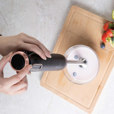 Product image of Hand blender. Part of the Black Rose Collection . Features: • Material: stainless steel, plastic • Voltage: 220-240V 50-60Hz • Power: 800W • Color: black- rose gold. (Studio view). Official Berlinger Haus product, boosted by Promintra sl.