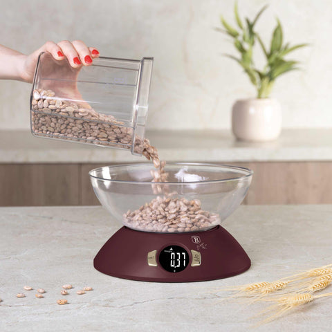 Product image of Kitchen scale with bowl. Part of the Leonardo Collection . Features: • Material: plastic • LCD display • Capacity: 5 kg • AAA battery included • Accessories: • Measuring cup: 25 ml • Egg separator • Color: matt bordeaux. (Studio view). Official Berlinger Haus product, boosted by Promintra sl.