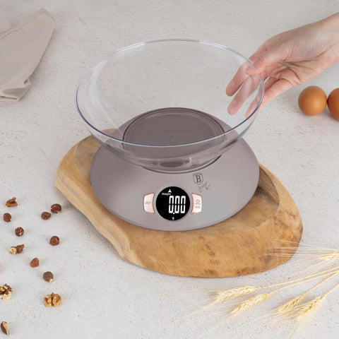 Product image of Kitchen scale with bowl. Part of the Taupe Collection . Features: • Material: plastic • LCD display • Capacity: 5 kg • AAA battery included • Accessories: • Measuring cup: 25 ml • Egg separator • Color: matt taupe. (Conceptual view). Official Berlinger Haus product, boosted by Promintra sl.