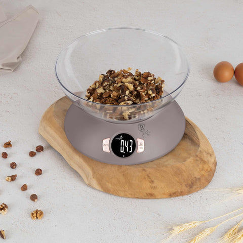 Product image of Kitchen scale with bowl. Part of the Taupe Collection . Features: • Material: plastic • LCD display • Capacity: 5 kg • AAA battery included • Accessories: • Measuring cup: 25 ml • Egg separator • Color: matt taupe. (Conceptual view). Official Berlinger Haus product, boosted by Promintra sl.