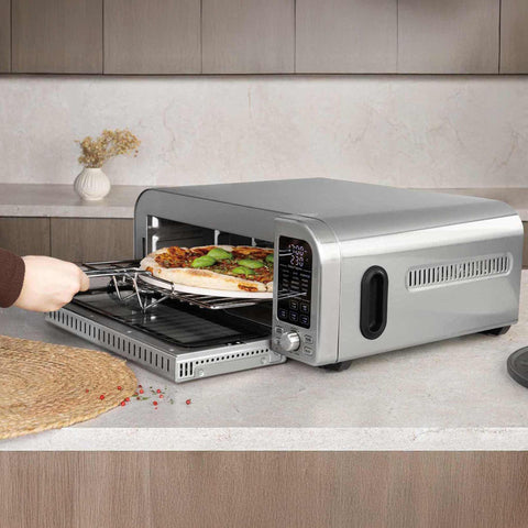 Product image of Pizza oven. Part of the Black Vantage Collection/Matte Black Collection/Black Silver Collection/Eternal Collection . Features: • Power: 2000W • Voltage: 220-240 V • Capacity: 18 L (12" pizza) • 6 accessories: • Oven rack • Aluminium bottom tray • Chrome air fry basket • Dou.... (Studio view). Official Berlinger Haus product, boosted by Promintra sl.