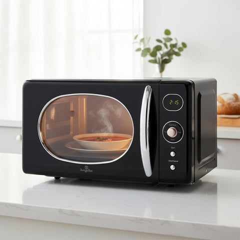 Product image of Digital microwave oven 20L. Part of the Black Rose Collection . Features: • Input power: 1200W/ 2450 MHz • Output power: 800W • Capacity: 20L • Glass plate: Ø24,5 cm • Size: 26,2*45,2*38,6 cm • Color: black- rose gold. (Studio view). Official Berlinger Haus product, boosted by Promintra sl.