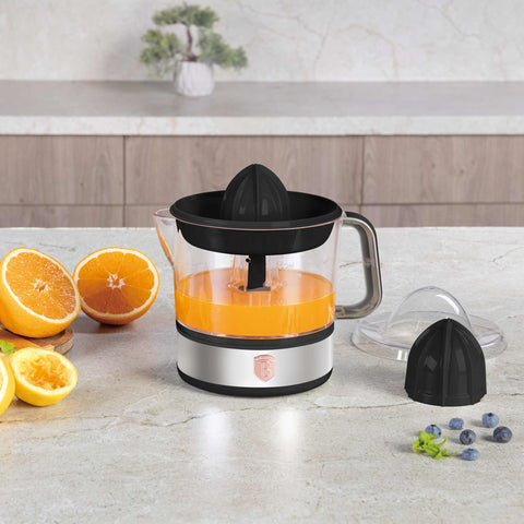 Product image of Electric citrus juicer. Part of the Black Rose Collection . Features: • Material: plastic, stainless steel • 220-240V/230VAC 50Hz 40W • Capacity: 0,7 L • Color: black- rose gold. (Studio view). Official Berlinger Haus product, boosted by Promintra sl.