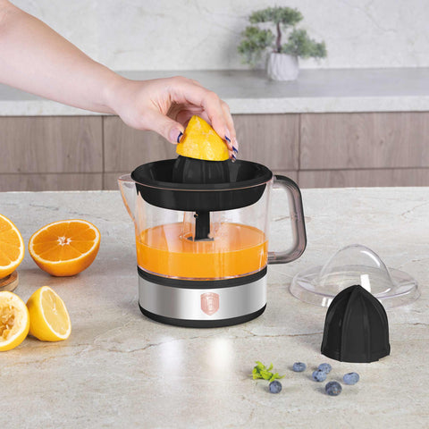 Product image of Electric citrus juicer. Part of the Black Rose Collection . Features: • Material: plastic, stainless steel • 220-240V/230VAC 50Hz 40W • Capacity: 0,7 L • Color: black- rose gold. (Studio view). Official Berlinger Haus product, boosted by Promintra sl.