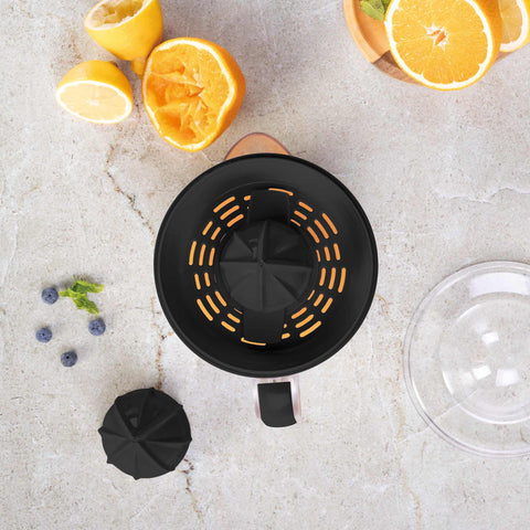 Product image of Electric citrus juicer. Part of the Black Rose Collection . Features: • Material: plastic, stainless steel • 220-240V/230VAC 50Hz 40W • Capacity: 0,7 L • Color: black- rose gold. (Studio view). Official Berlinger Haus product, boosted by Promintra sl.
