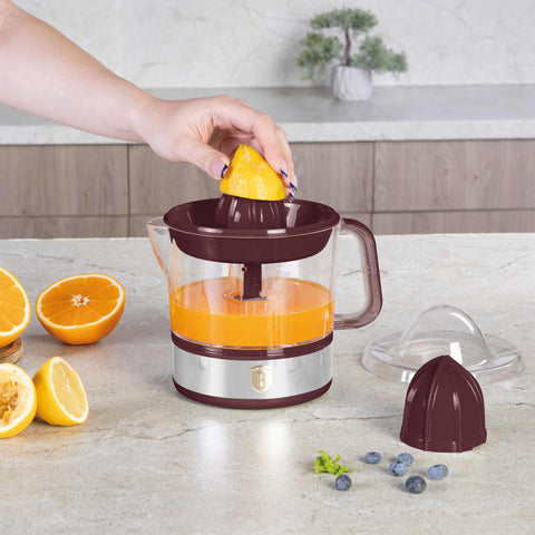 Product image of Electric citrus juicer. Part of the Leonardo Collection . Features: • Material: plastic, stainless steel • 220-240V/230VAC 50Hz 40W • Capacity: 0,7 L • Color: stainless steel- bordeaux. (Studio view). Official Berlinger Haus product, boosted by Promintra sl.