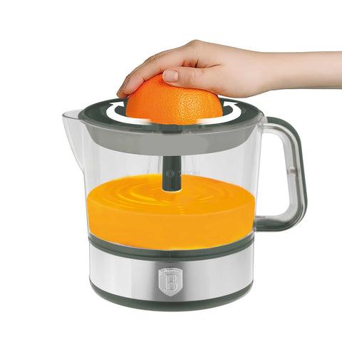 Product image of Electric citrus juicer. Part of the Matte Green Collection . Features: • Material: plastic, stainless steel • 220-240V/230VAC 50Hz 40W • Capacity: 0,7 L • Color: stainless steel- green. (Studio view). Official Berlinger Haus product, boosted by Promintra sl.