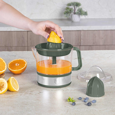 Product image of Electric citrus juicer. Part of the Matte Green Collection . Features: • Material: plastic, stainless steel • 220-240V/230VAC 50Hz 40W • Capacity: 0,7 L • Color: stainless steel- green. (Studio view). Official Berlinger Haus product, boosted by Promintra sl.