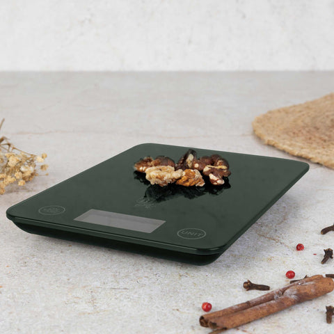 Product image of Digital glass kitchen scale capacity 5kg. Part of the Matte Green Collection . Features: • Material: tempered glass and plastic • Capacity: 5 kg • Size: 19,5*14,5 cm • Weight unit: g/oz/ml/lb/fl • 2 pcs AAA battery included • Color: green. (Studio view). Official Berlinger Haus product, boosted by Promintra sl.