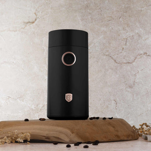 Product image of Electric coffee grinder. Part of the Black Rose Collection . Features: • Power: 150 W • 220V-240V 50/60 Hz • Stainless steel bowl • Stainless steel blades • Color: black- rose gold. (Conceptual view). Official Berlinger Haus product, boosted by Promintra sl.