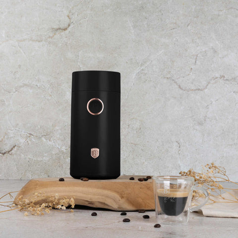 Product image of Electric coffee grinder. Part of the Black Rose Collection . Features: • Power: 150 W • 220V-240V 50/60 Hz • Stainless steel bowl • Stainless steel blades • Color: black- rose gold. (Conceptual view). Official Berlinger Haus product, boosted by Promintra sl.