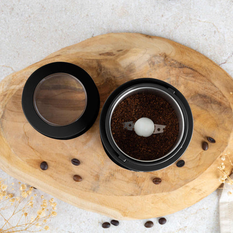 Product image of Electric coffee grinder. Part of the Black Rose Collection . Features: • Power: 150 W • 220V-240V 50/60 Hz • Stainless steel bowl • Stainless steel blades • Color: black- rose gold. (Conceptual view). Official Berlinger Haus product, boosted by Promintra sl.