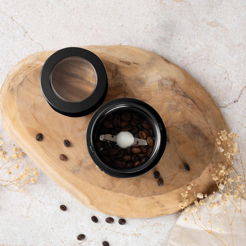 Product image of Electric coffee grinder. Part of the Black Rose Collection . Features: • Power: 150 W • 220V-240V 50/60 Hz • Stainless steel bowl • Stainless steel blades • Color: black- rose gold. (Conceptual view). Official Berlinger Haus product, boosted by Promintra sl.
