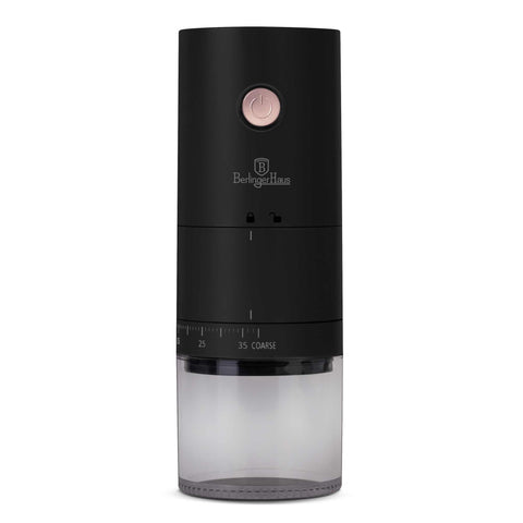 Product image of Rechargeable portable coffee grinder. Part of the Black Rose Collection . Features: • Ceramic grinder • Rechargeable battery: 2000 mAh • Accessories: • Cleaning brush • Type C cable • Color: black- rose gold. (Studio view). Official Berlinger Haus product, boosted by Promintra sl.