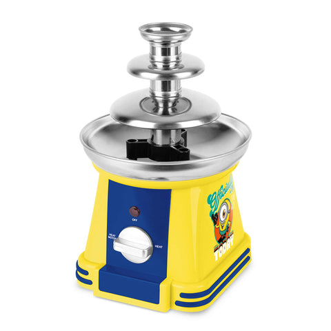 Product image of Chocolate fountain. Part of the Minions Collection . Features: • Material: stainless steel, plastic • 220-240 V, 50/60Hz, 32 W • Capacity: 50g • Size: 15*15*24 cm • Length of power cord: 1 m • Color: yellow- blue. (Studio view). Official Berlinger Haus product, boosted by Promintra sl.