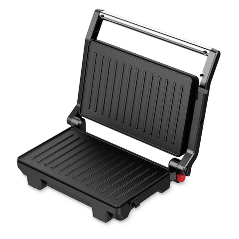 Imatge del producte de la barbacoa elèctrica. Part de la col·lecció Blaumann/Black Silver. Característiques: • Potència: 1000 W • Voltatge: 220-240 V, 50/60 Hz • Mida de la placa: 23*14,5 cm • Revestiment ANTIADHERENT a la placa • Indicador lluminós de preparació • Longitud del cable d'alimentació:... (Vista d'estudi). Producte oficial de Berlinger, impulsat per Promintra sl.