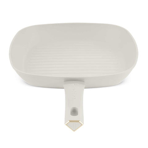 Product image of Grill pan 28cm. Part of the MATTE CREAM- GOLD . Features: • Material: forged aluminum with non-stick titanPro coating • Grill pan Ø28*4,1 cm 2,1L • Color: matt cream- gold. (Studio view). Official Berlinger Haus product, boosted by Promintra sl.