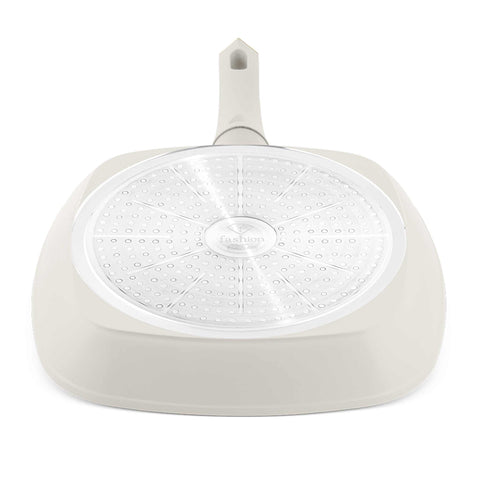 Product image of Grill pan 28cm. Part of the MATTE CREAM- GOLD . Features: • Material: forged aluminum with non-stick titanPro coating • Grill pan Ø28*4,1 cm 2,1L • Color: matt cream- gold. (Studio view). Official Berlinger Haus product, boosted by Promintra sl.
