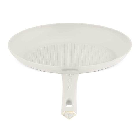 Product image of Fish pan 35x25cm. Part of the MATTE CREAM- GOLD . Features: • Material: forged aluminum with non-stick titanPro coating • Fish pan Ø35*25*4,5 cm • Color: matt cream- gold. (Studio view). Official Berlinger Haus product, boosted by Promintra sl.