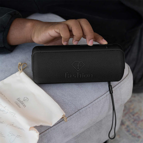 Product image of Bluetooth speaker medium size. Part of the MATTE BLACK- ROSE GOLD . Features: • Size: 8,5*8,9*21 cm • Bluetooth version 5.2 • Accessories: • Type C charging cable • Travel bag • Color: black- rose gold. (Studio view). Official Berlinger Haus product, boosted by Promintra sl.
