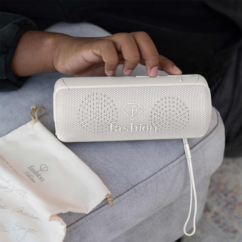 Product image of Bluetooth speaker medium size. Part of the MATTE CREAM- GOLD . Features: • Size: 8,5*8,9*21 cm • Bluetooth version 5.2 • Accessories: • Type C charging cable • Travel bag • Color: cream- gold. (Studio view). Official Berlinger Haus product, boosted by Promintra sl.