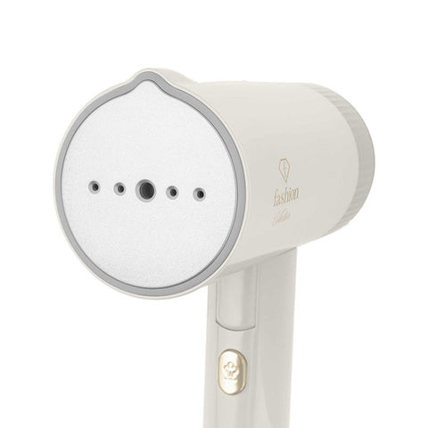 Product image of Foldable garment steamer. Part of the MATTE CREAM- GOLD . Features: • 220-240V, 50/60Hz, 1000 W • Steam panel with ceramic coating • Removable water tank capacity: 100 ml • Accessory: • Travel bag • Length of power .... (Studio view). Official Berlinger Haus product, boosted by Promintra sl.