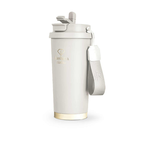 Product image of Coffee mug 0,5L. Part of the MATTE CREAM- GOLD . Features: • High resistance painting • Material: inner body 18/10 stainless steel, cap: plastic • Capacity: 0,5 L • Color: cream- gold • Packing: color giftbox. (Studio view). Official Berlinger Haus product, boosted by Promintra sl.
